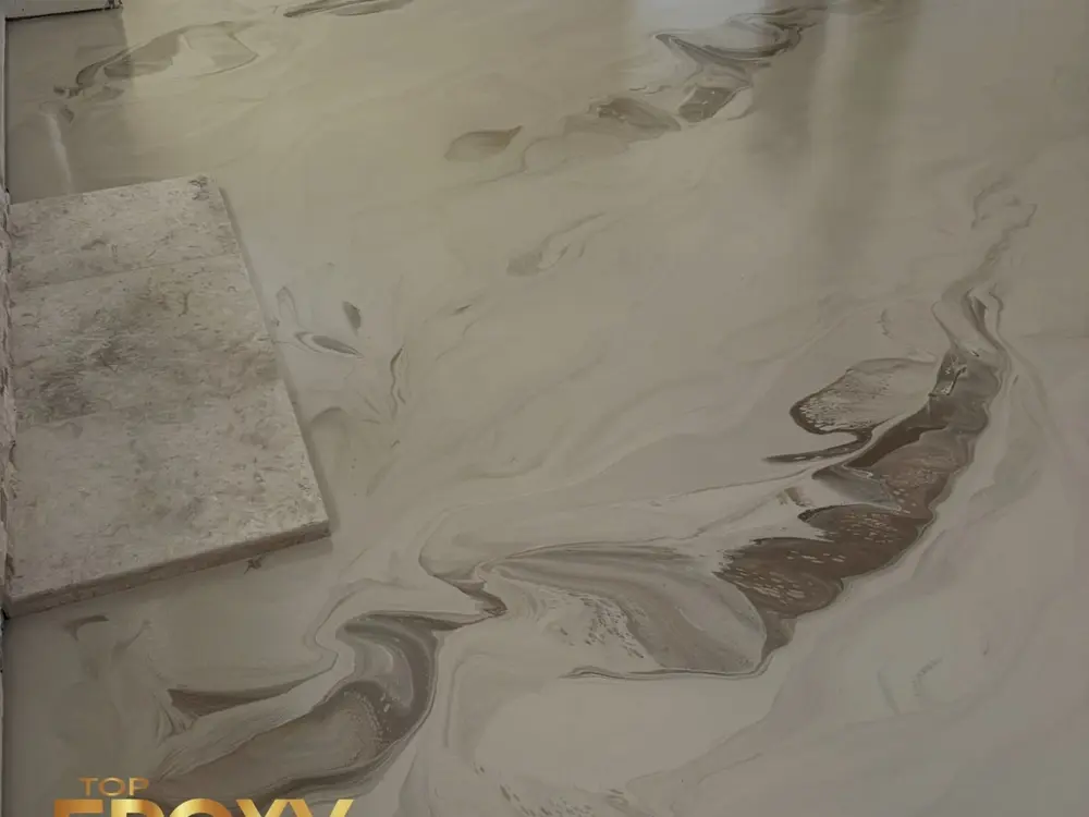 Marble epoxy floor Brown-vein marble-look epoxy floor installed in a Saugus home