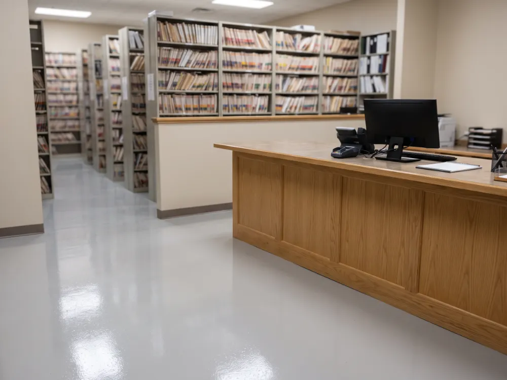 Clerk records office with a sealed light epoxy floor and filing shelves