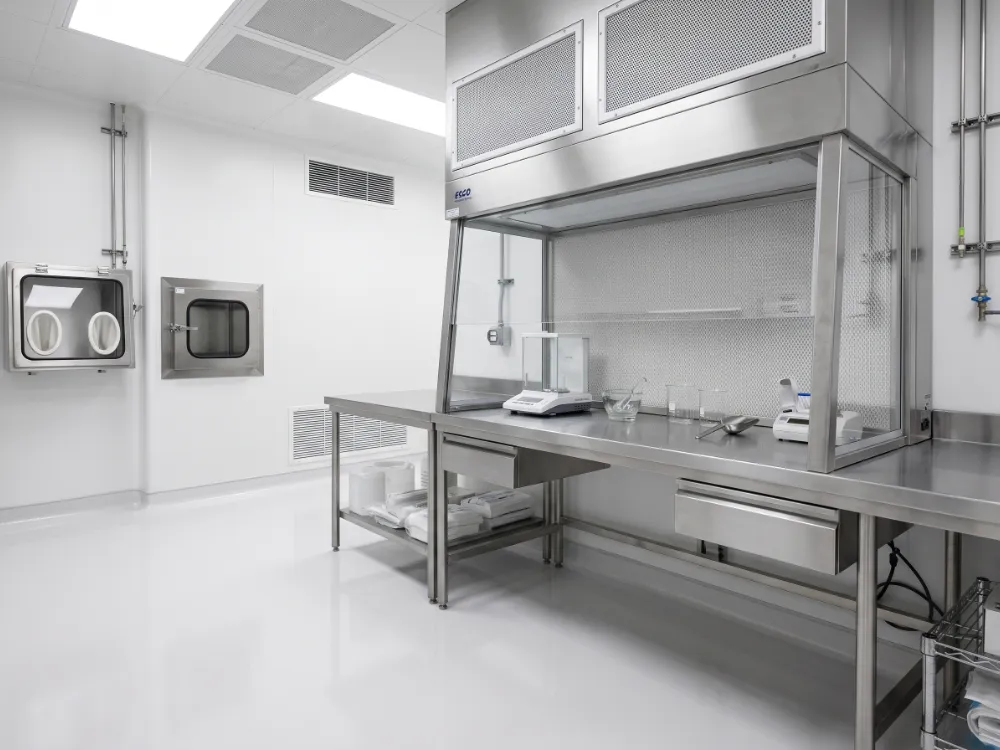 Compounding cleanroom with a seamless coved white epoxy floor