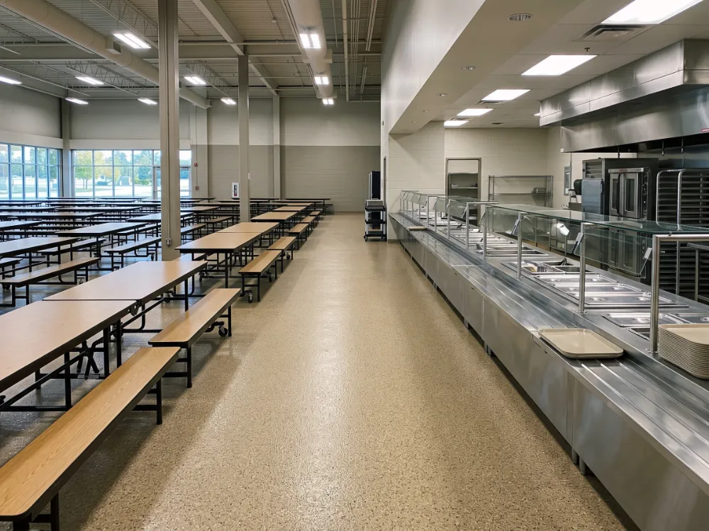 Institutional dining facility with a beige flake epoxy floor