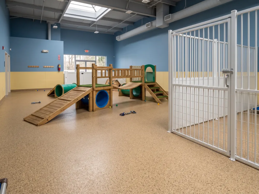 Indoor daycare play area with a durable tan flake epoxy floor