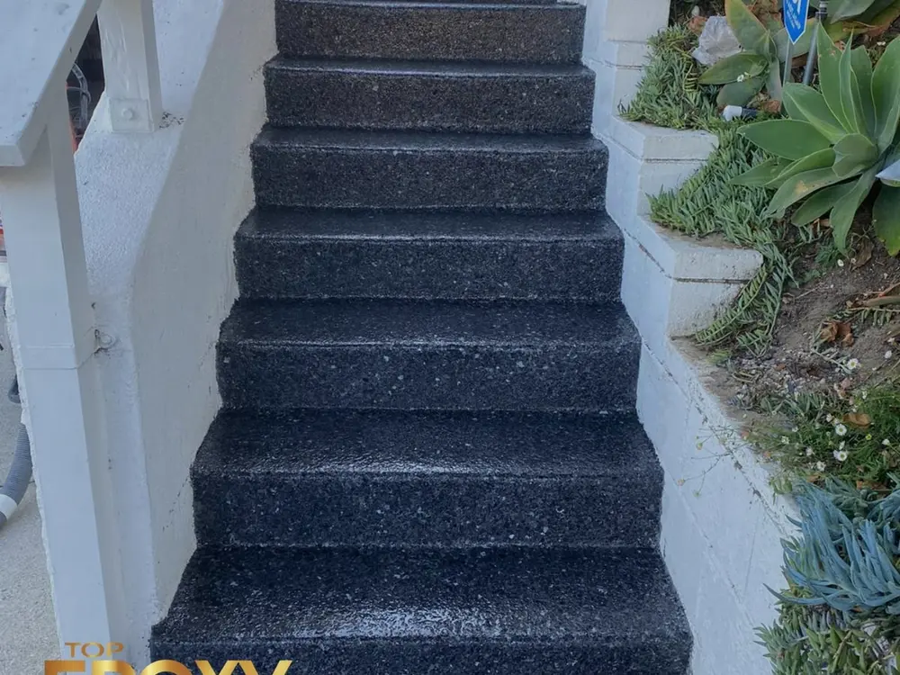 Flake system with stairs Black-flake epoxy system carried up concrete steps at a Santa Clarita property