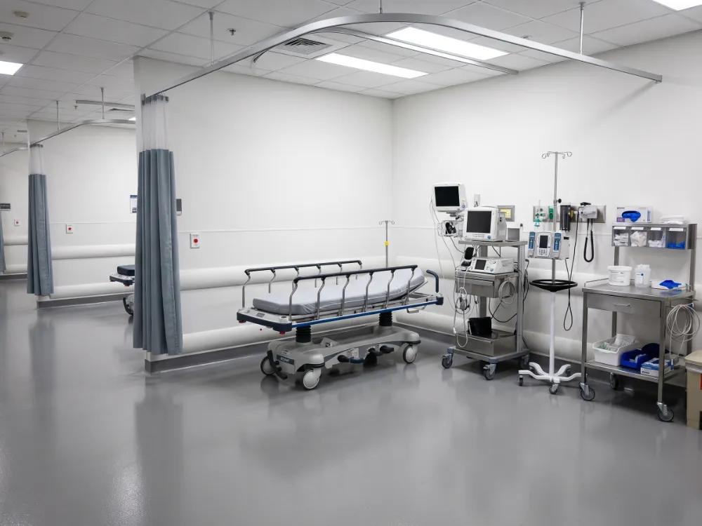 Emergency treatment bay with a seamless coved epoxy floor and gurney