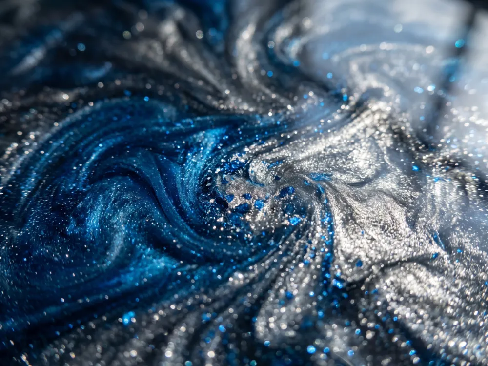 Deep ocean-blue and silver metallic epoxy swirls with three-dimensional depth under clear coat