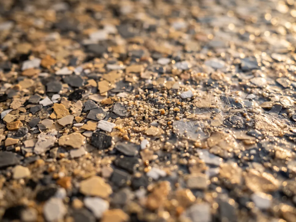 Outdoor flake patio surface with fine slip-resistant texture in golden sunlight