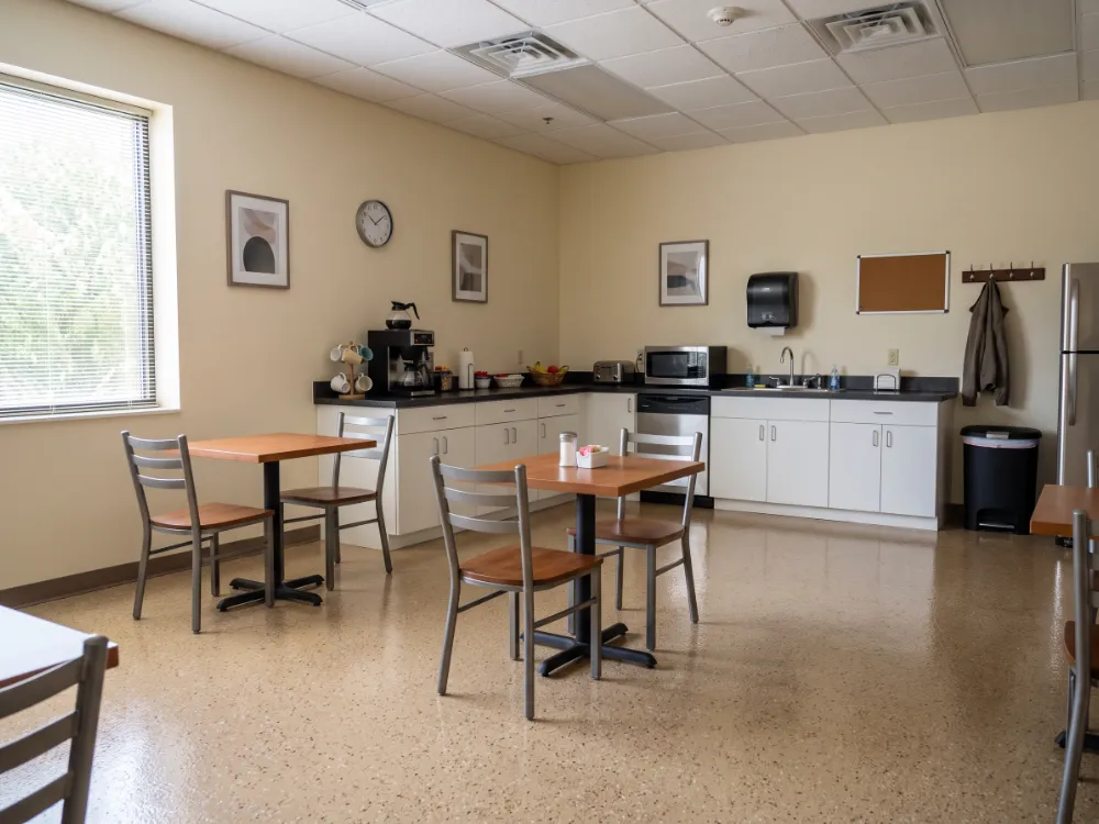 Staff break room with a warm beige flake epoxy floor