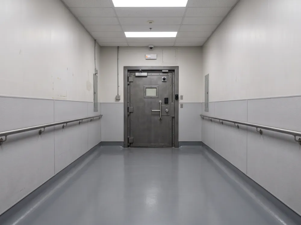Secure transfer corridor with a seamless coved epoxy floor