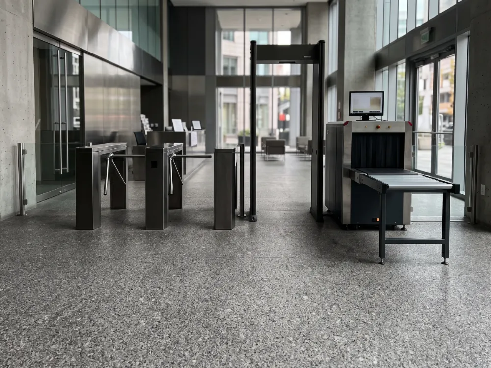 Building security entrance with a textured gray quartz epoxy floor