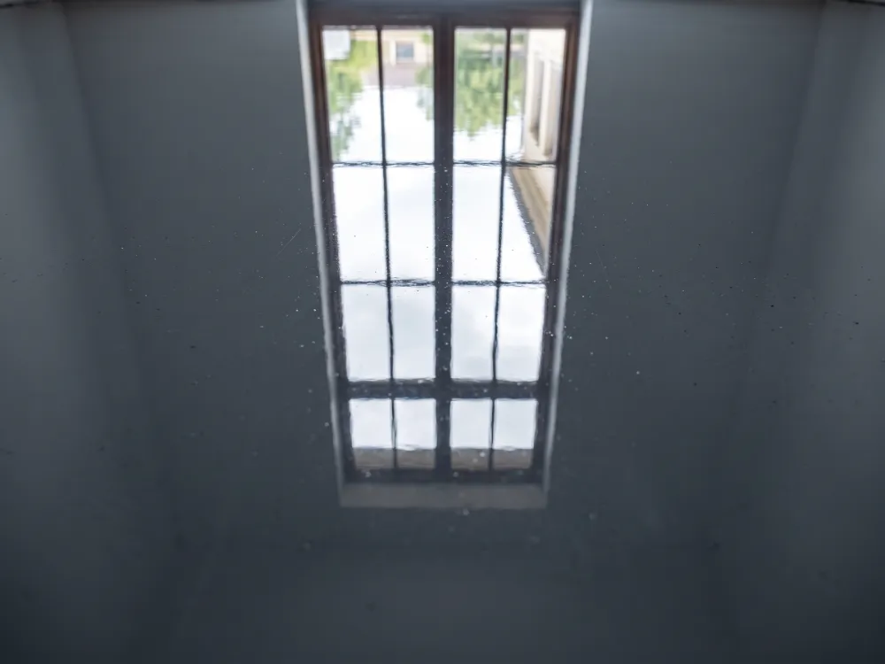 Slate gray solid epoxy surface with a crisp window reflection across the seamless gloss
