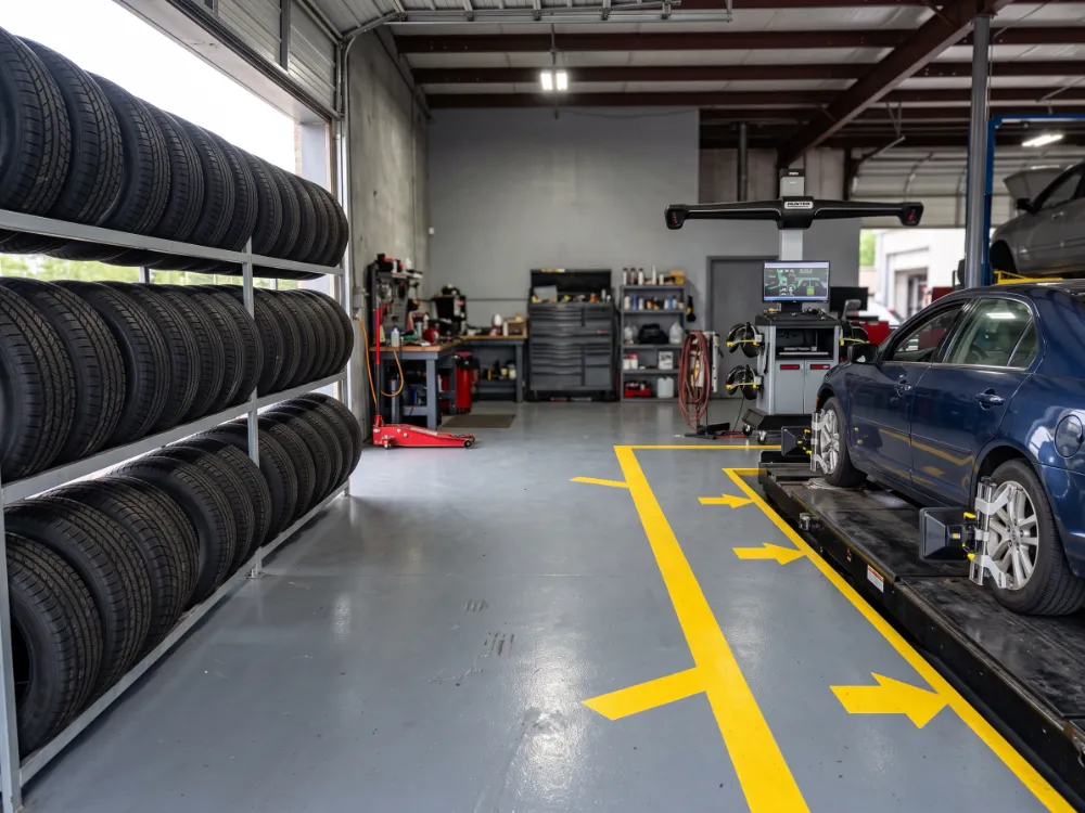 Tire and alignment bay with coated-in yellow guide lines