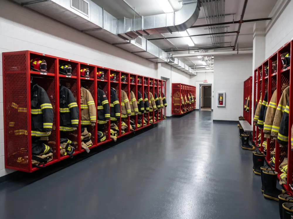Turnout gear room with a seamless charcoal epoxy floor and gear lockers
